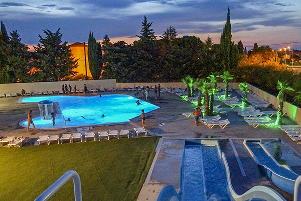 evening night swimming pool camping mas de l'isle